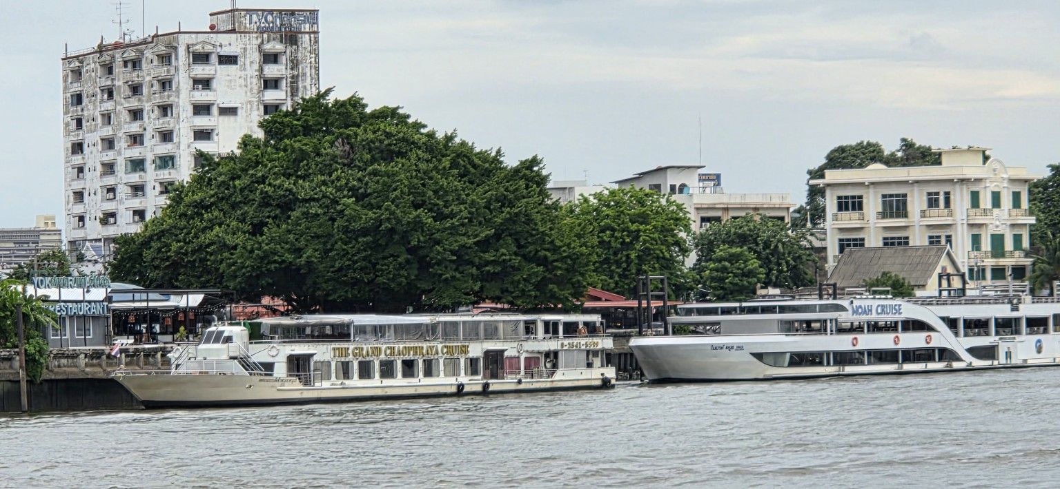 Cruise boats moored along the Chao Phraya River